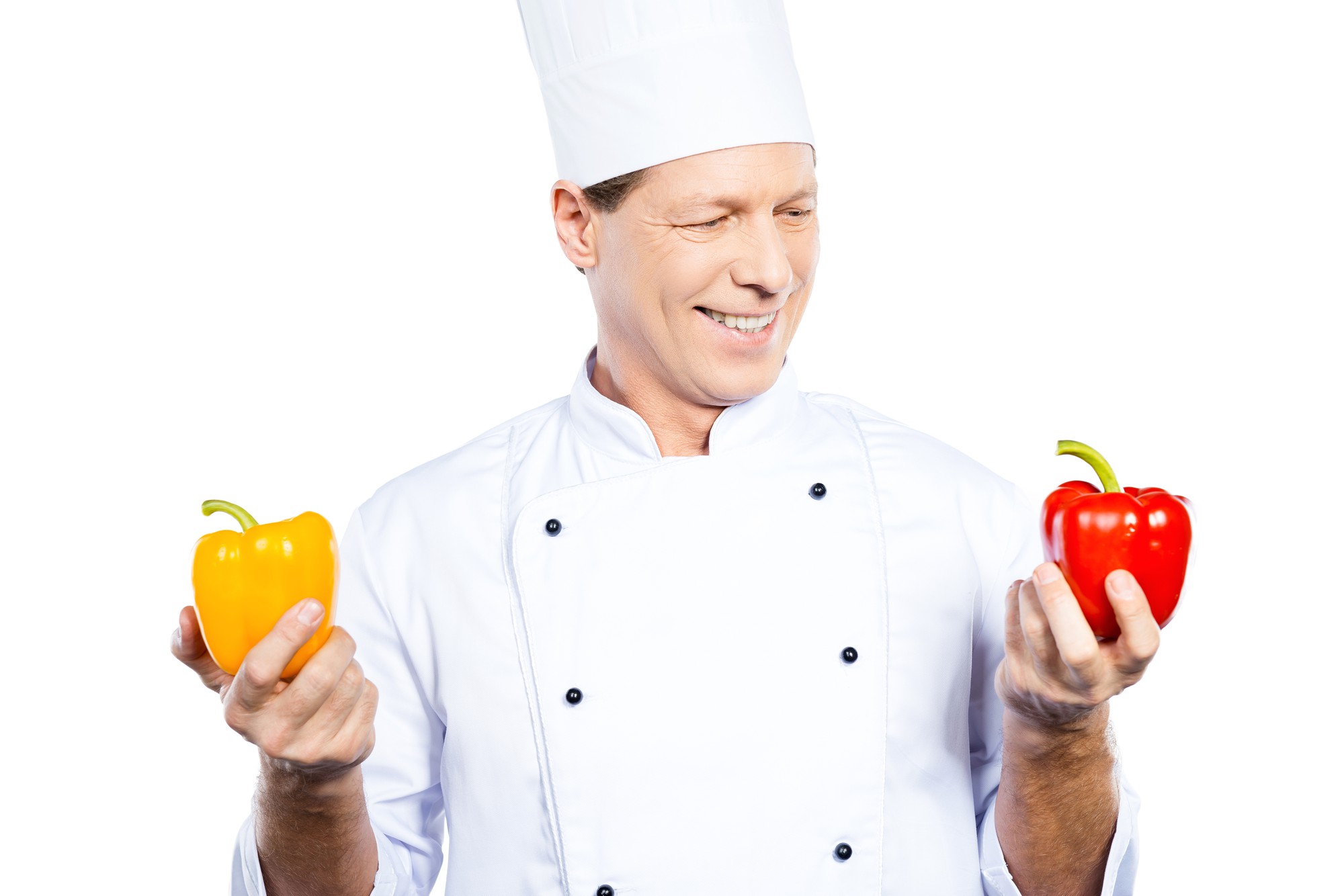 Workshop chef smiling in a compact teaching kitchen