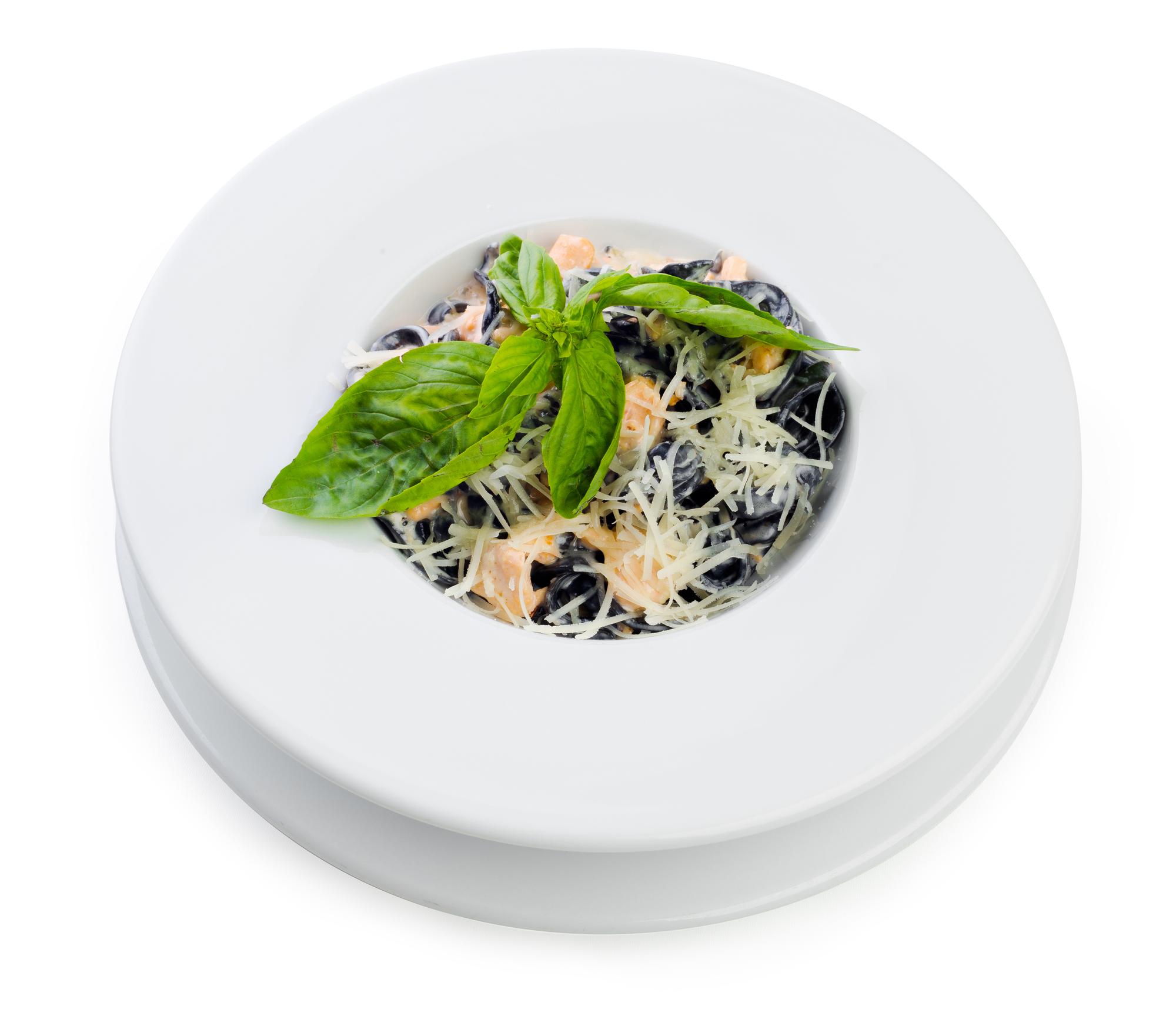 Close-up of a plated pasta with herb garnish